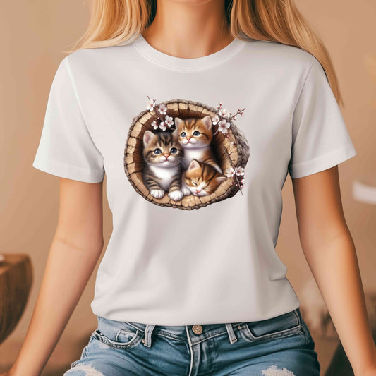 Three kittens in hollow tree trunk with white blossoms T-Shirt