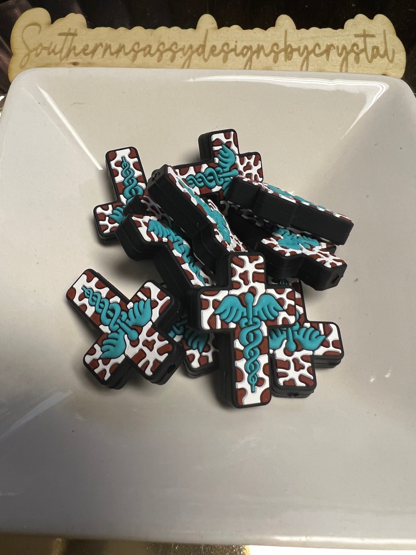 Cross with brown cow print